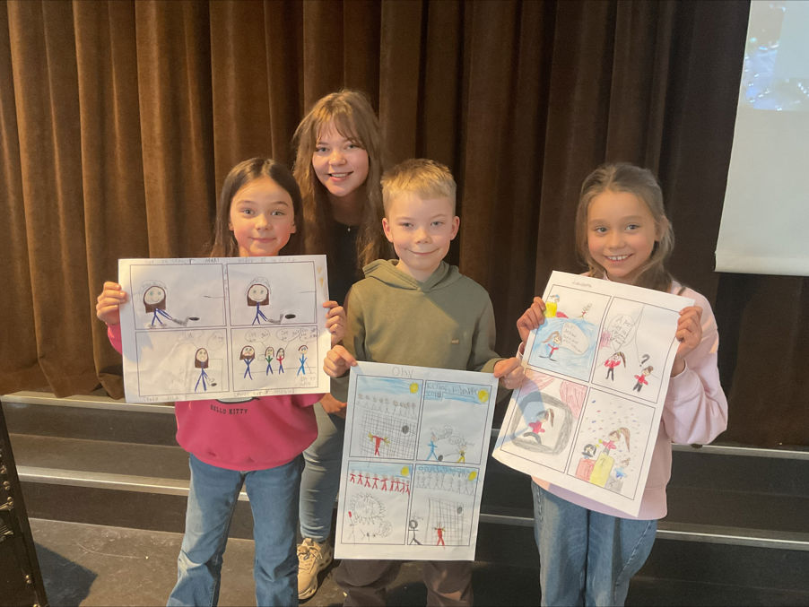 en gruppe barn som holder opp skilt